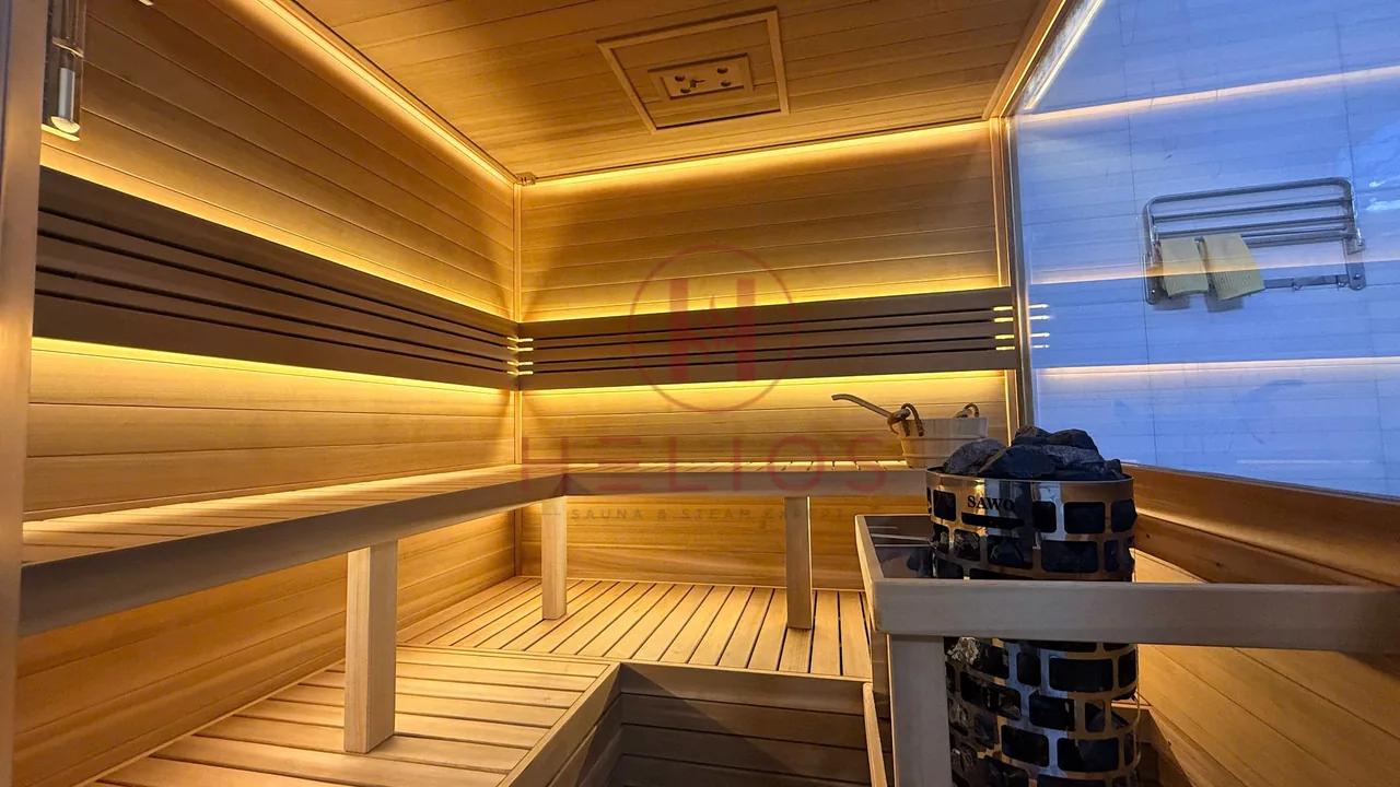 Phòng sauna ghế chữ L với máy xông và khung bảo vệ tại công trình Thanh Hóa